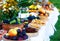 Meals on table of abundance as a part of natural wedding ceremony held in nature.