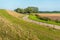 Meandering country road in a Dutch polder