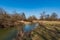 Meandering Odra river in CHKO Poodri with meadow and trees around during beautiful springtime day