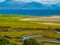 Meandering river, Atlantic Ocean and Mountains