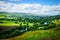 Meandering River making its way through lush green rural