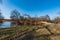 Meandering river with trees around and clear sky during early springtime day - Odra river in CHKO Poodri in Czech republic