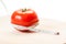 Measure calories of a red tomato with a centimeter. Diet concept