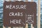 Measure crabs here sign