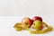 Measure tape and fresh fruits apples, pear on white background. Loss weight, slim body, healthy diet concept