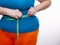 Measure the waist with a centimeter tape. The problem of excess weight. Full belly and folds. Hands of a woman dieting. Losing