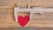 measures the size of the heart over wooden background