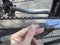 Measuring bike chain segment length with a plastic ruler,detailed view.