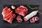 Meat appetizer platter with sausage, and cold cuts, above view on a slate serving board