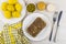 Meat aspic, knife, fork, mustard, horseradish, green peas, boiled potatoes