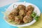 Meat balls with white rice and green peas