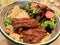 Meat Bowl with Couscous and Salad at Restaurant