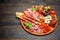 Meat and cheese plate with salami sausage, chorizo, parma and mozzarella