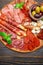 Meat and cheese plate with salami sausage, chorizo, parma and mozzarella