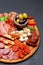 Meat and cheese plate with salami sausage, chorizo, parma and mozzarella