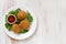 Meat croquette on white plate