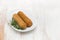 Meat croquettes on white dish