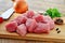 Meat cubes, raw red meat on wooden board