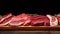 Meat cuts selection displayed in wooden ray at a butcher shop or a supermarket section