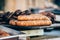 Meat delicacies and smoked meats on the market counter. Bushmeat. Sausages and pork.