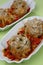 Meat dumplings with rice in tomato sauce