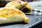 Meat empanadas with olives and red pepper.