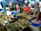 Meat and fish vendor in a wet market in cubao , quezon city, philippines