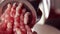 Meat grinder close-up, fatty pork mincing