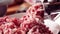 Meat grinder close up - minced pork