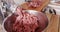 Meat grinder - mincing pork and beef,  steadicam close-up