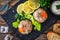 Meat in jelly, toasted bread and fresh vegetables on wooden table