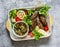 Meat kebab , grilled vegetables sauce, zucchini, flatbread, green salad - a delicious mediterranean style lunch on a gray