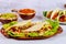 Meat, lettuce, tomato and cheese in soft tortillas. Mexican cuisine