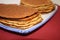 Meat pancakes on red background