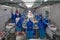 Meat production. workers behind a conveyor belt at a meat factory