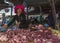 Meat for sale by female butcher on the market.