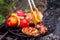 Meat skewered with vegetables on grill grate