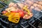 Meat skewered and vegetables on grill grate