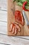 Meat smoked jerky - raw meat sausage meat. Close up view on tasty sliced Chicken basturma on parchment on a wooden board