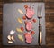 Meat steak - fresh and raw, seasonings and vintage meat fork on