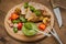 Meat with vegetables, grilled and served Italian Salsa Verde sauce. Wooden rustic table. Close-up