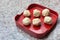 Meatballs are contained meat, flavoring and chopped vegetable which served on a red plate in Shabu or Sukiyaki restaurant