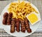 Meatballs meat french fries mutard plate