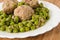 Meatballs with peas.