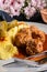 Meatballs pork and mashed potatoes topped with paprika gravy