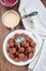 Meatballs served with cream sauce and cranberry jam, swedish cuisine, vertical,  top view