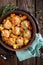 Meatballs stewed with vegetables on wooden table