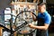 Mechanic Assembling Bicycle Wheels