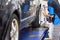 Mechanic attaching the wheel alignment device onto the wheel at workshop