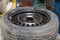 Mechanic changing car tire fitting. Wheel tyre repairing. Wheel inflation